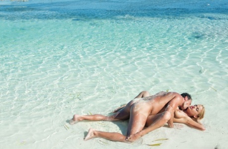 Hot blonde with big tits takes off her bikini before PTM sex on tropical beach 65624299