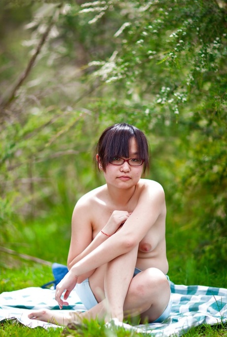 Hairy Asian amateur Gita slowly taking off her clothes outdoors 65620174