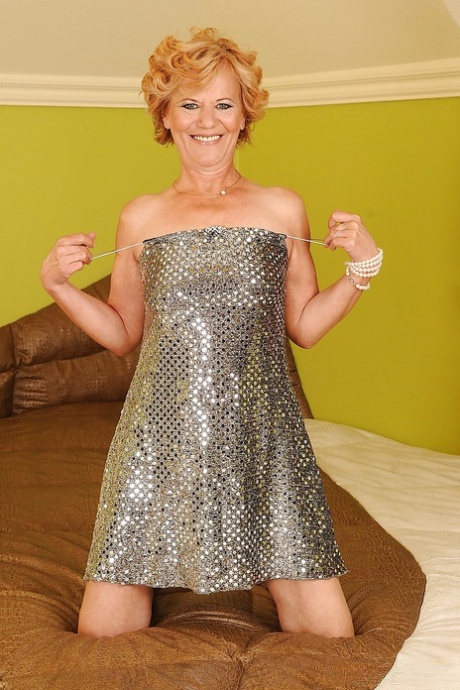 Naughty granny on high heels stripping off her dress and spreading her legs 65271343